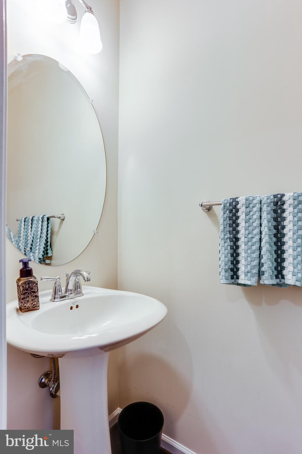 1109 Red Hawk Way Severn, MD 21144 - Photo 9 of 29 a bathroom with a sink and a mirror