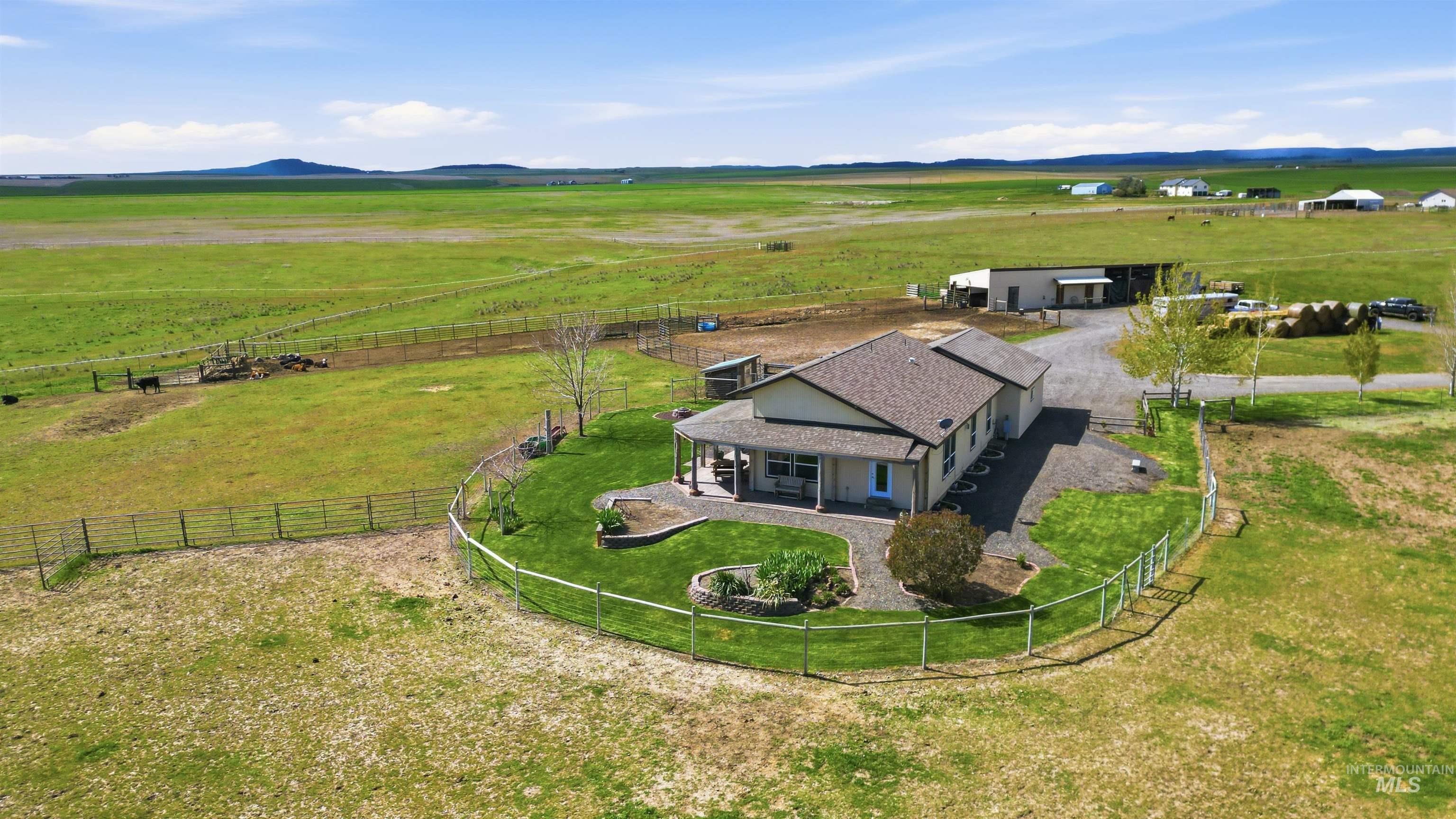 19397 Cloverland Road Asotin, WA 99402 - Photo 26 of 37 Ranch-style residence featuring a covered front porch, fenced yard with established landscaping, and a gravel driveway