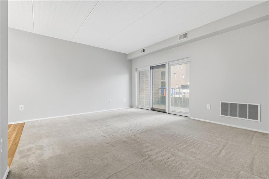 5600 Munhall Road, Unit 202 Pittsburgh, PA 15217 - Photo 10 of 24 a view of an empty room with a window