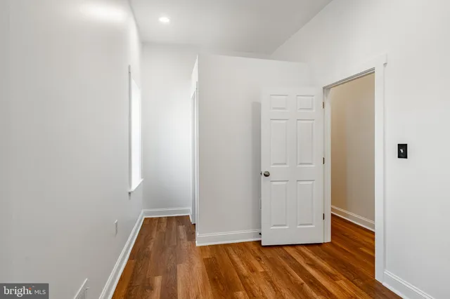 a view of front door with wooden floor