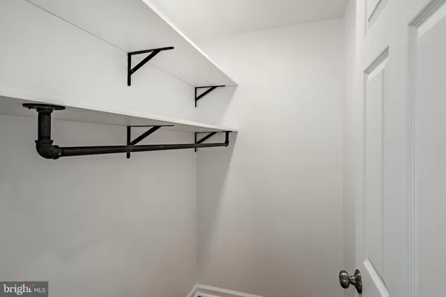 a view of a room with rack on the wall