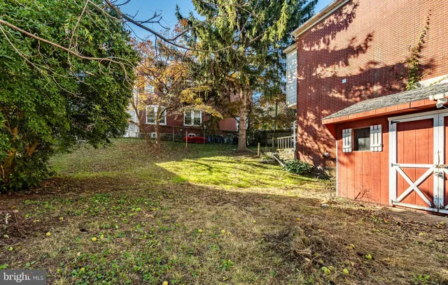a view of a house with pool and yard