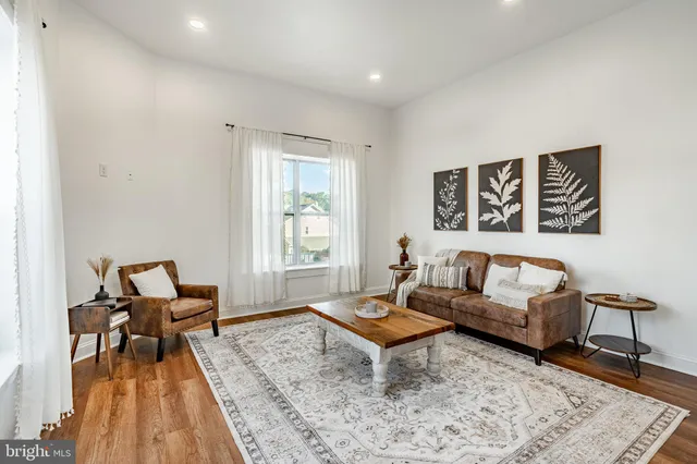 a living room with furniture and a rug