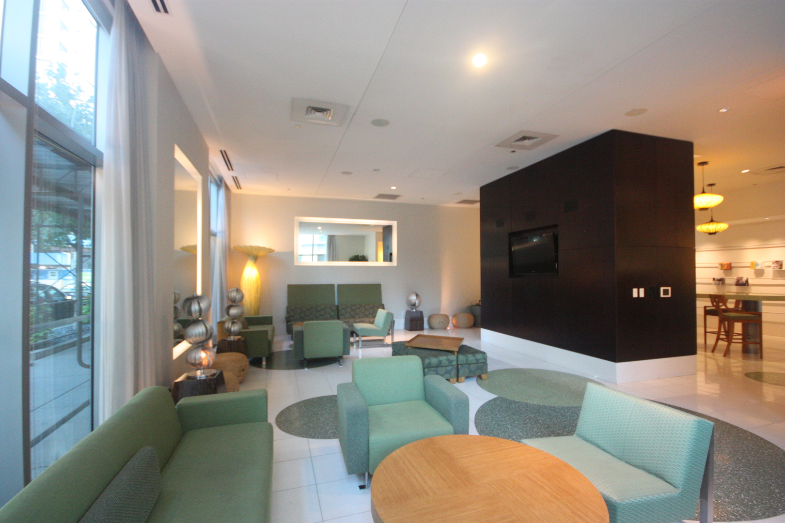 125 South Green Street, Unit 1202A Chicago, IL 60607 - Photo 12 of 15 a living room with furniture and a flat screen tv