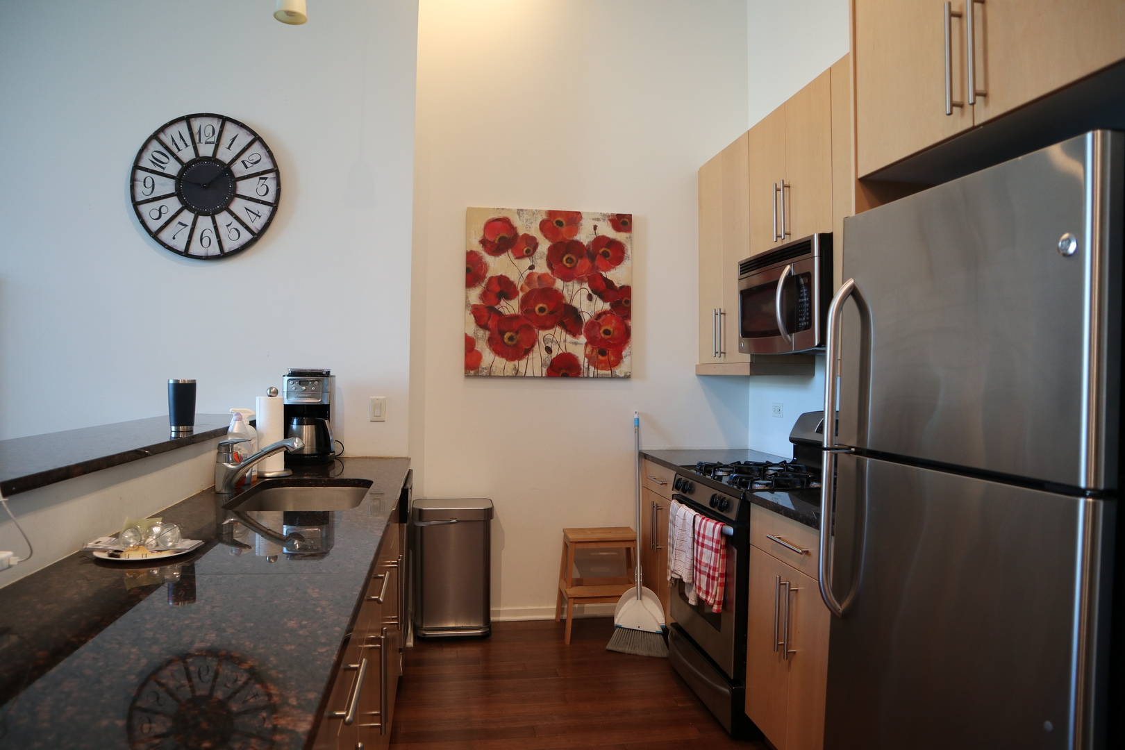125 South Green Street, Unit 1202A Chicago, IL 60607 - Photo 4 of 15 a kitchen with a refrigerator and a stove
