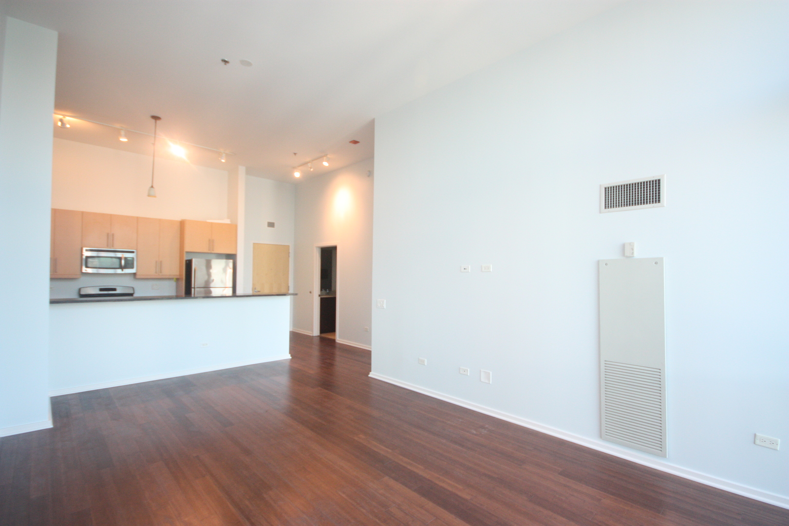 125 South Green Street, Unit 1202A Chicago, IL 60607 - Photo 6 of 15 a view of a kitchen with a sink and a refrigerator