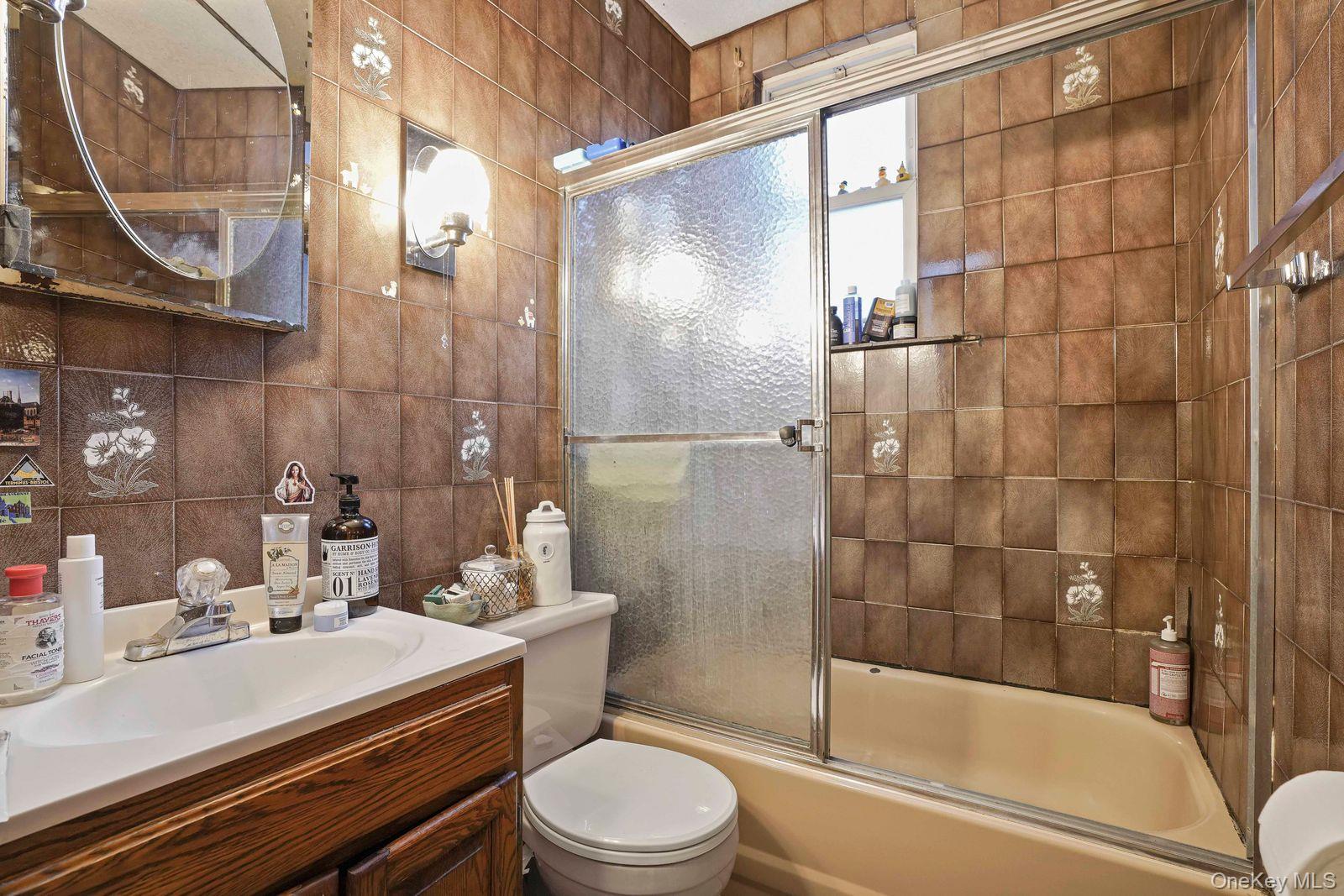 1920 Palmetto Street Queens, NY 11385 - Photo 12 of 26 a bathroom with a sink toilet and shower