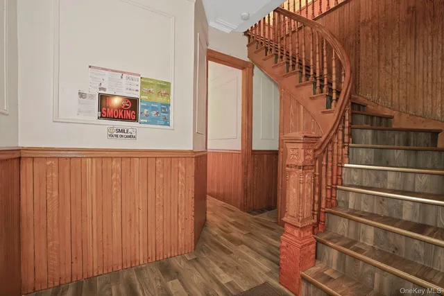 a view of entryway with wooden floor