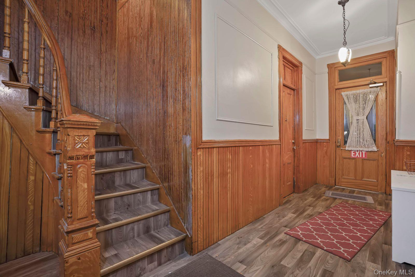 1920 Palmetto Street Queens, NY 11385 - Photo 18 of 26 a view of a hallway with wooden floor and entryway