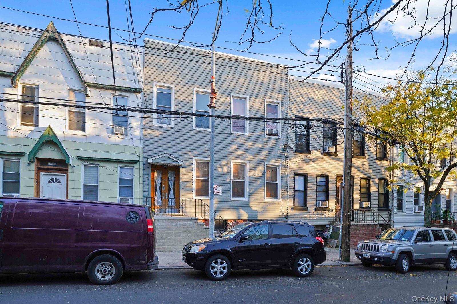 1920 Palmetto Street Queens, NY 11385 - Photo 2 of 26 a car parked in front of a building