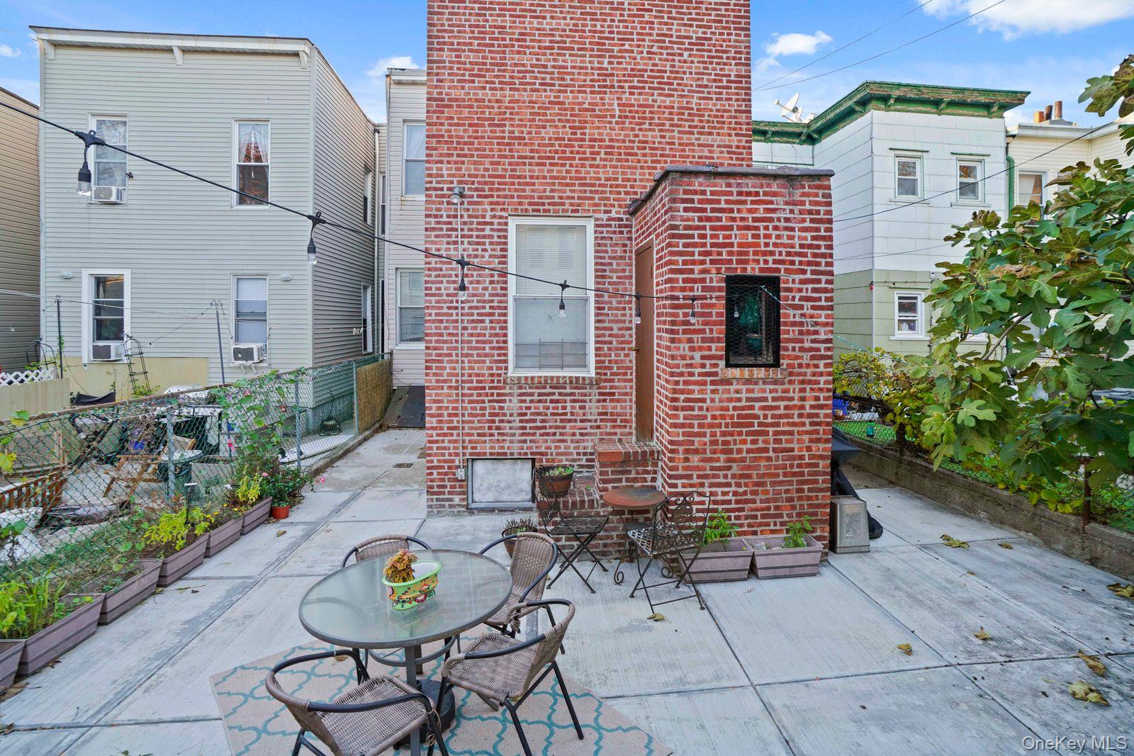 1920 Palmetto Street Queens, NY 11385 - Photo 23 of 26 a view of a patio with couple of chairs