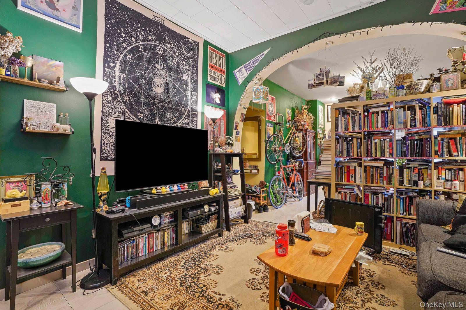 1920 Palmetto Street Queens, NY 11385 - Photo 8 of 26 a living room with furniture and a flat screen tv