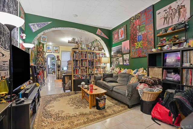 a living room with lots of furniture and a flat screen tv