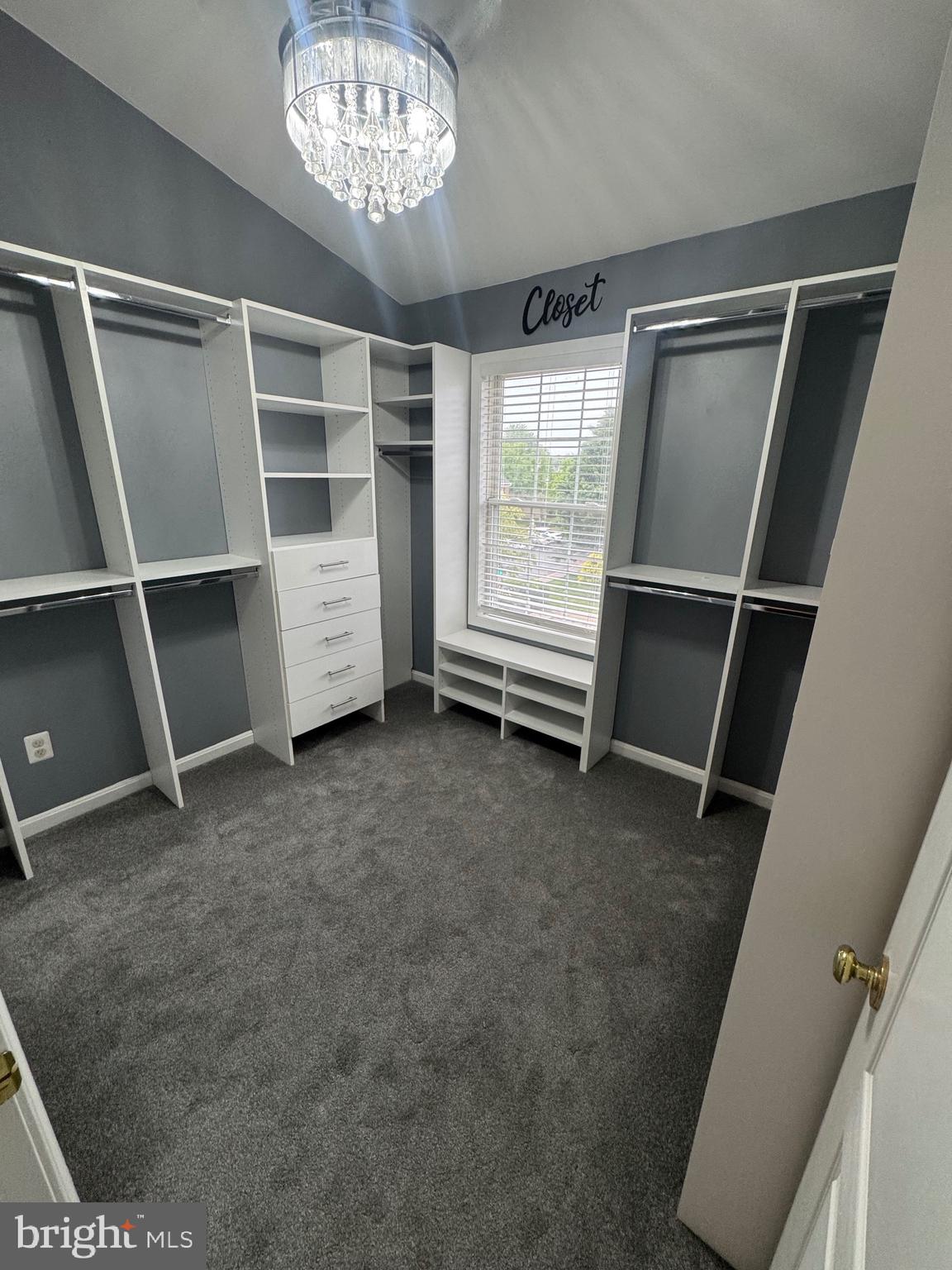 7705 Periwinkle Way, Unit 71 Severn, MD 21144 - Photo 25 of 28 a view of an empty room with a fireplace