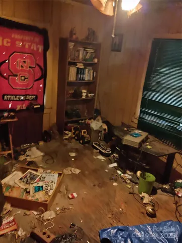 a room with a bed and a mirror