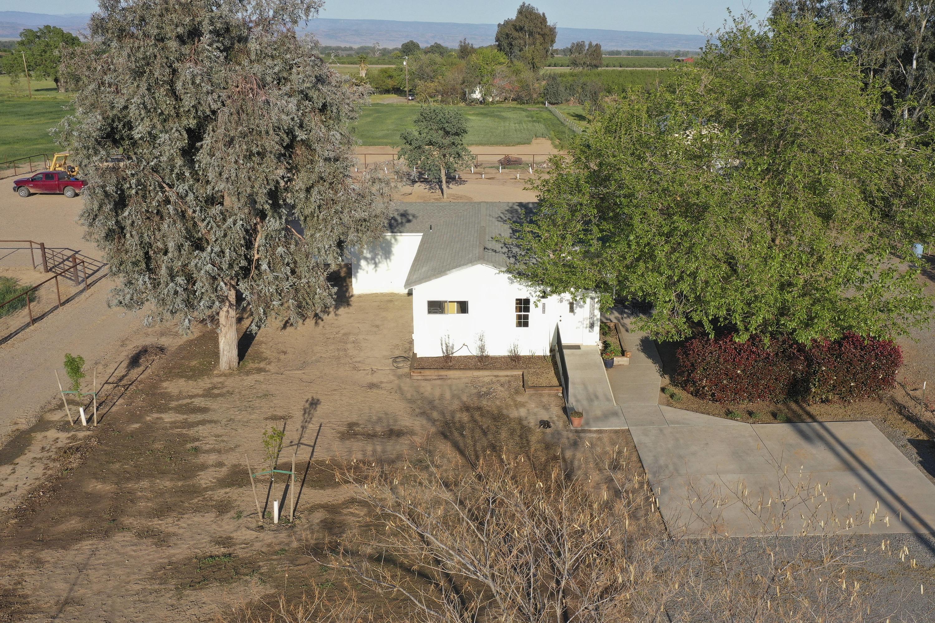 6280 Santa Clara Road Corning, CA 96021 - Photo 4 of 53 a picture of trees with wooden fence
