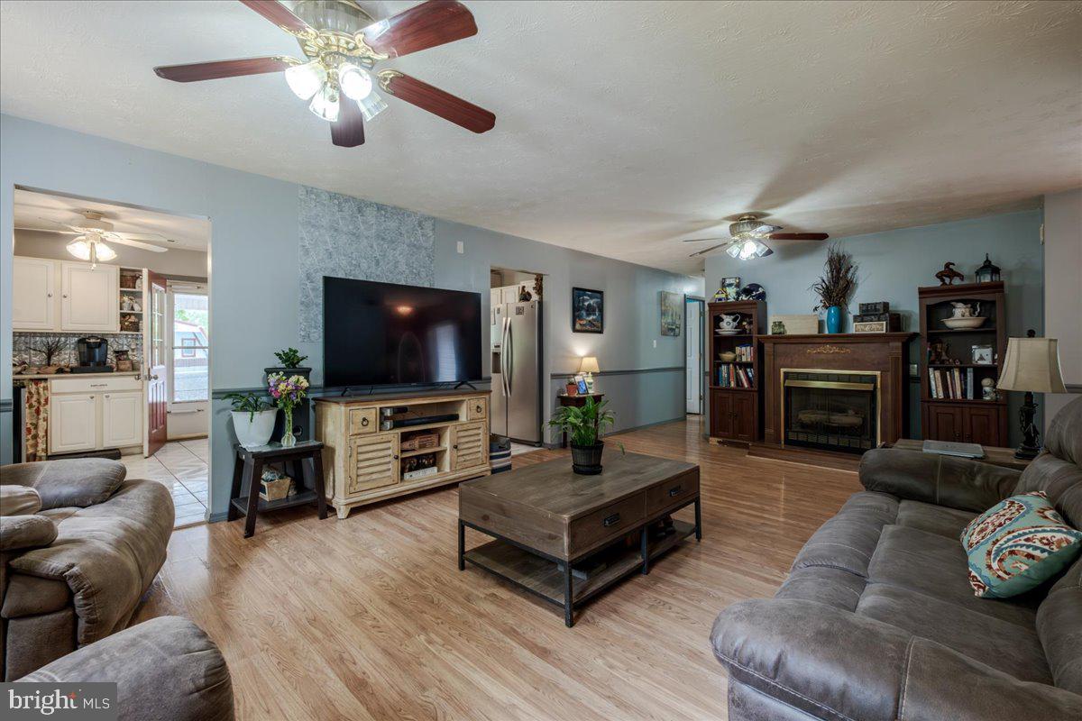 11419 Oak Grove Road Bristol, VA 24202 - Photo 9 of 36 a living room with furniture and a flat screen tv