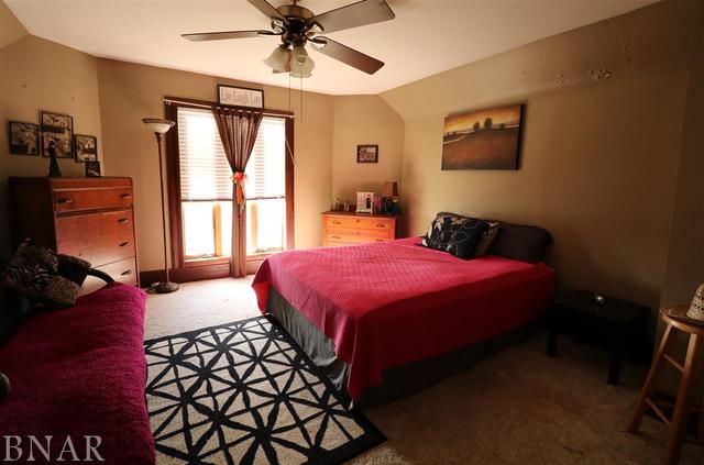 2234 Bearsdale Road Maroa, IL 61756 - Photo 11 of 17 a bedroom with a bed closet and a window