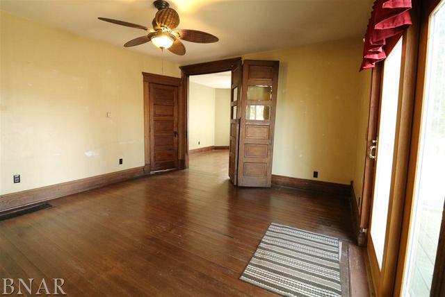 2234 Bearsdale Road Maroa, IL 61756 - Photo 14 of 17 a view of an empty room with window and wooden floor