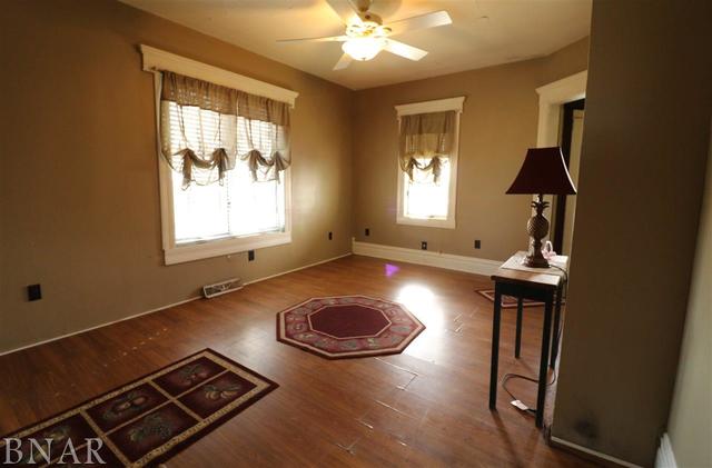 2234 Bearsdale Road Maroa, IL 61756 - Photo 4 of 17 wooden floor with windows and rug