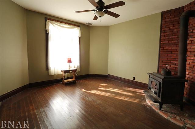 2234 Bearsdale Road Maroa, IL 61756 - Photo 5 of 17 a view of room with window and hardwood floor