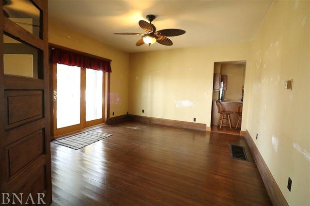 2234 Bearsdale Road Maroa, IL 61756 - Photo 6 of 17 wooden floor in an empty room with a window