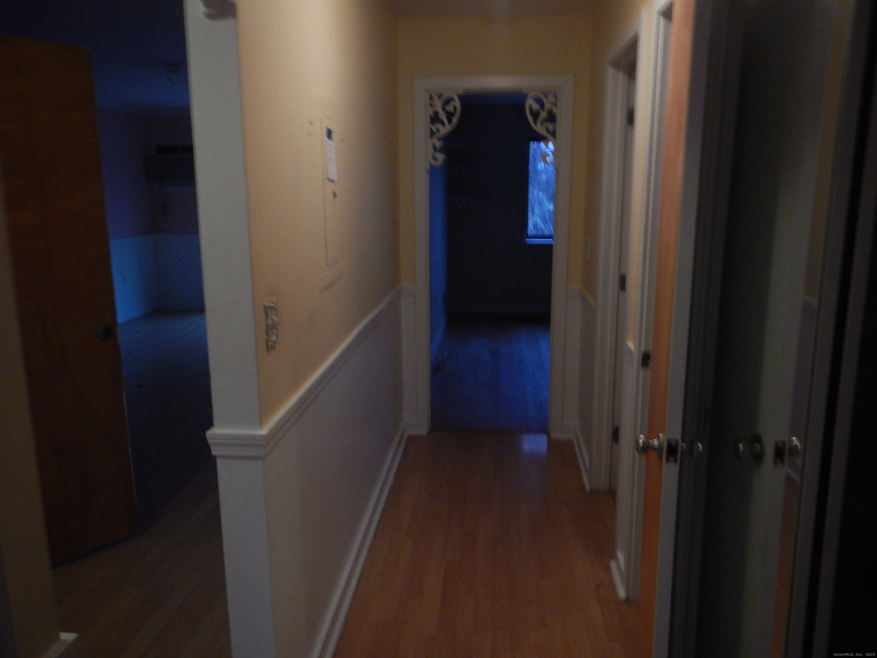 444 Asbury Ridge, Unit 444 Shelton, CT 06484 - Photo 4 of 7 a view of a hallway with wooden floor