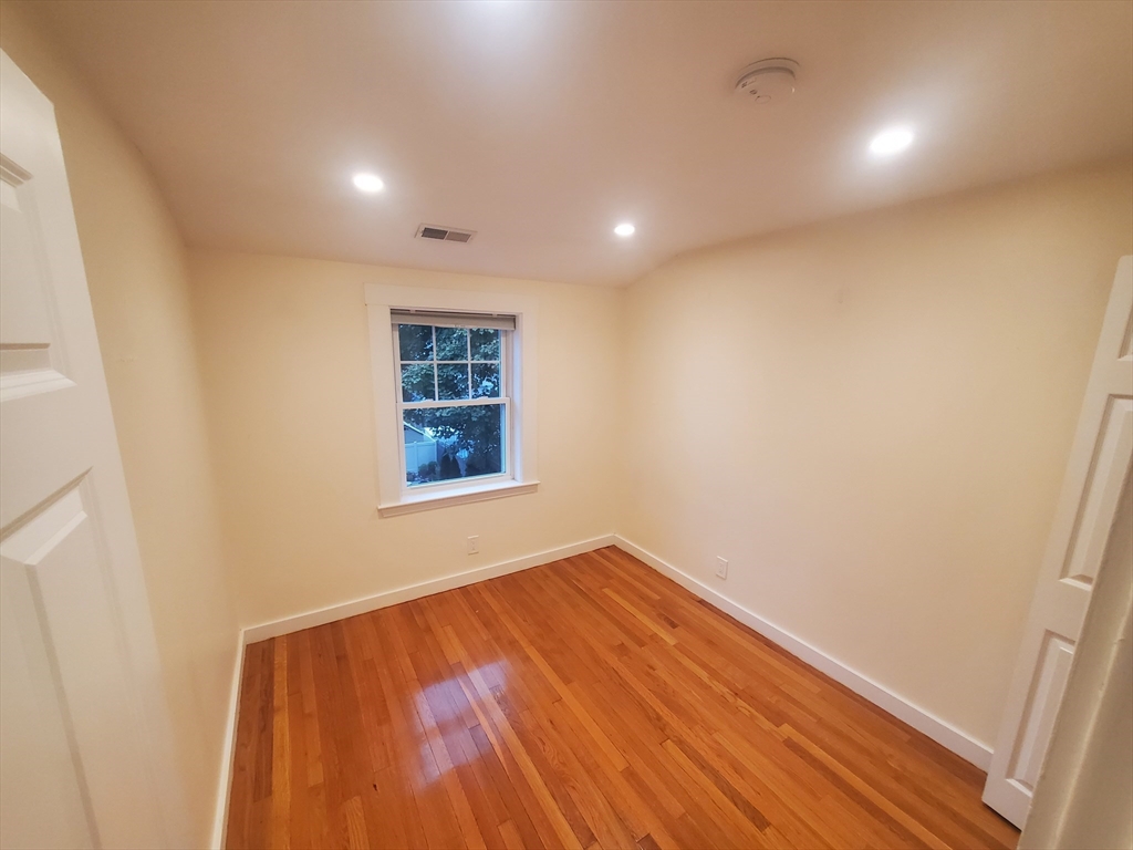 68 Nahant Avenue, Unit 2 Boston, MA 02122 - Photo 14 of 19 a view of empty room with wooden floor