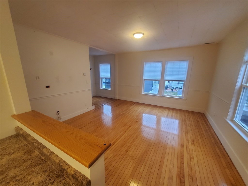 68 Nahant Avenue, Unit 2 Boston, MA 02122 - Photo 5 of 19 a view of room with window and wooden floor