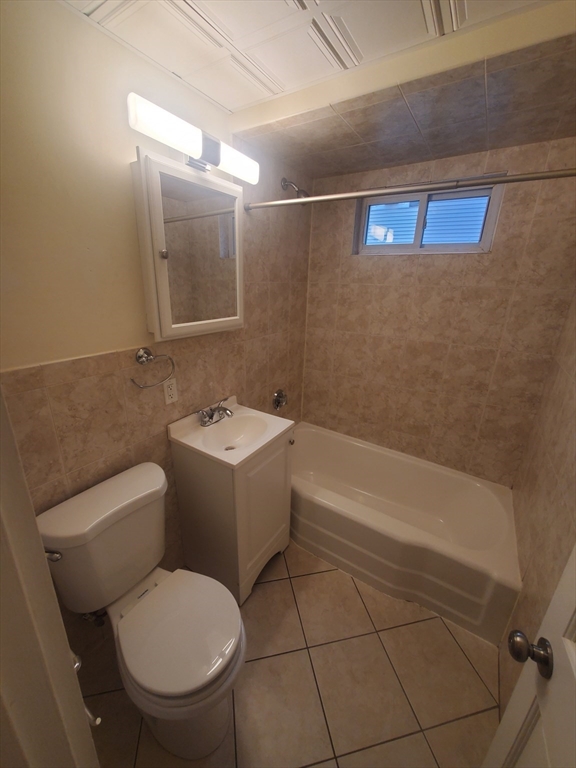 68 Nahant Avenue, Unit 2 Boston, MA 02122 - Photo 6 of 19 a bathroom with a toilet sink and mirror