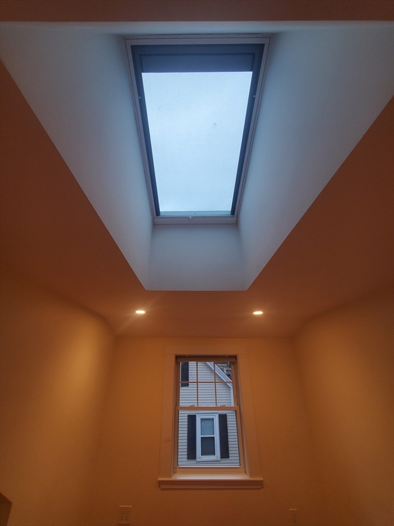 68 Nahant Avenue, Unit 2 Boston, MA 02122 - Photo 10 of 19 a view of a hallway with windows