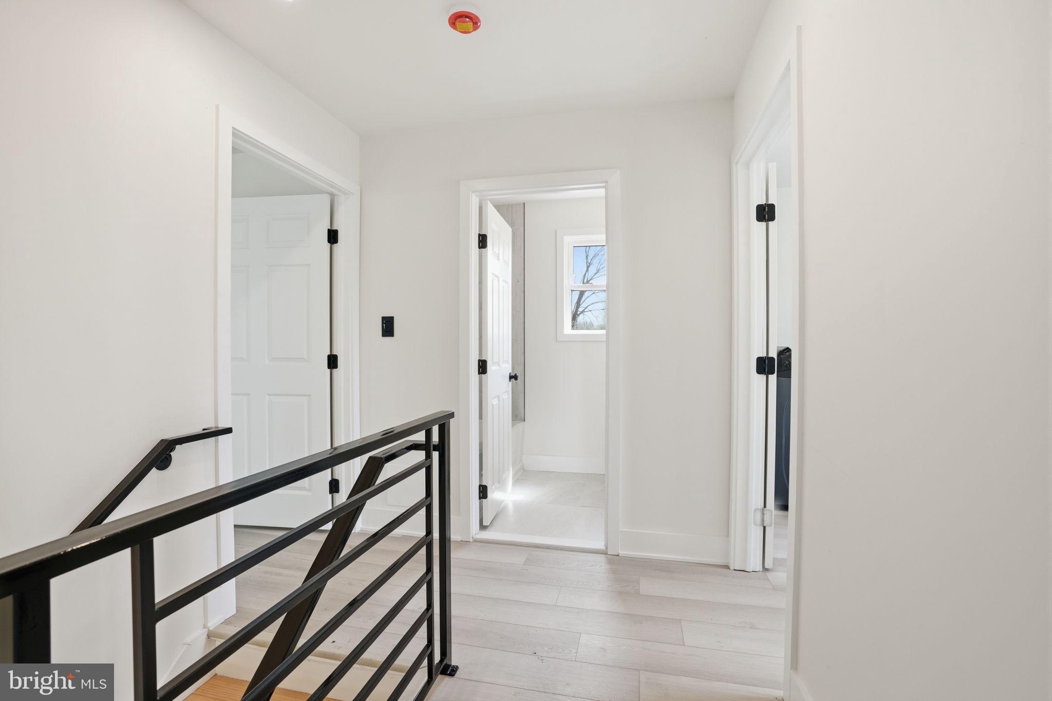511 Sternermill Road Feasterville-Trevose, PA 19053 - Photo 17 of 32 a view of a hallway with wooden floor and staircase