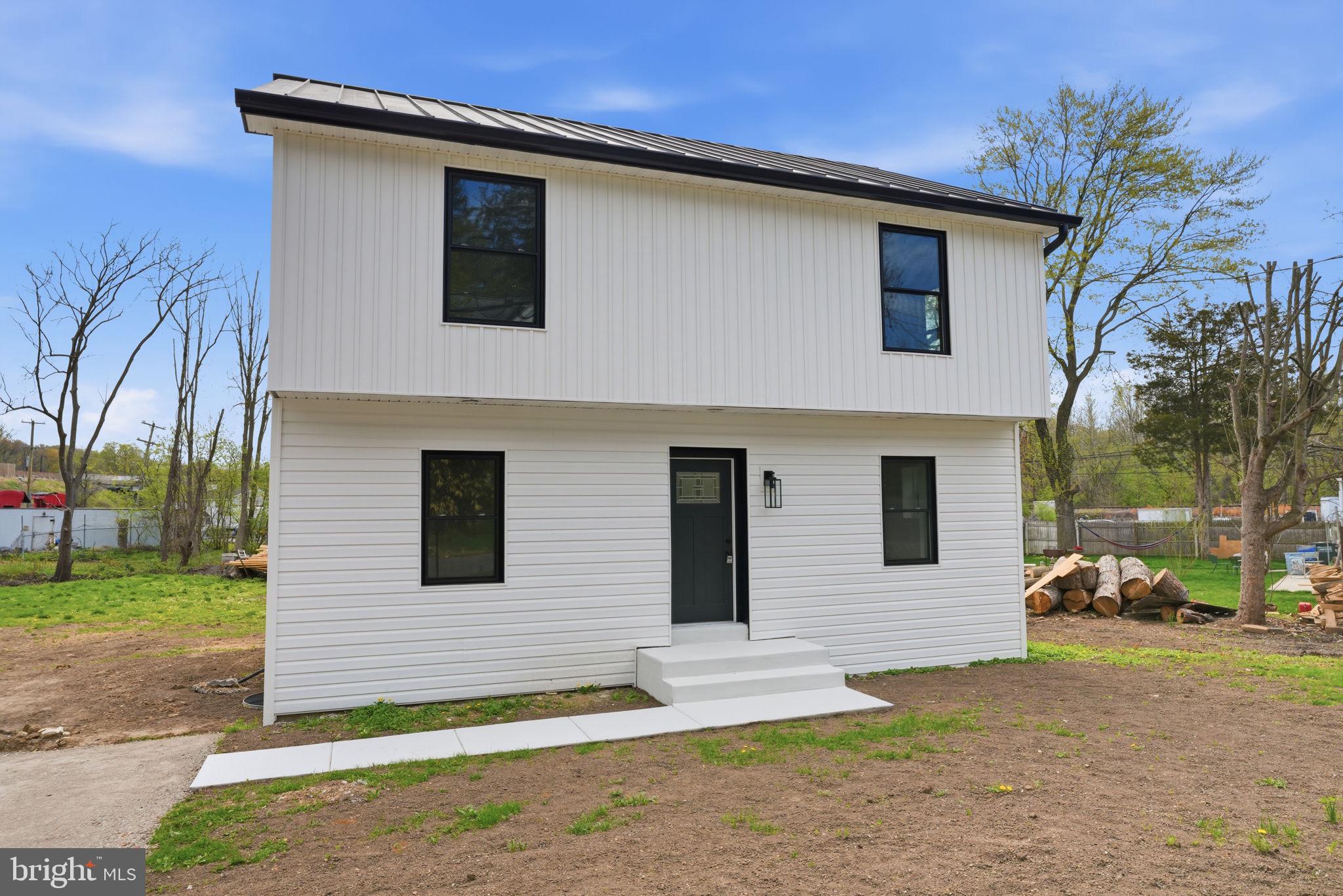 511 Sternermill Road Feasterville-Trevose, PA 19053 - Photo 2 of 32 a front view of a house with a yard and garage