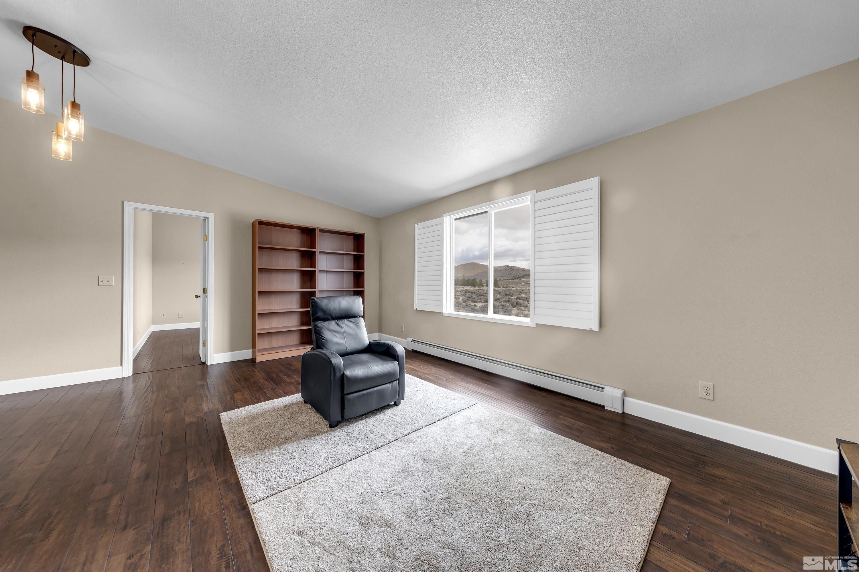 2055 Antelope Valley Road Reno, NV 89506 - Photo 18 of 40 wooden floor in an empty room with a window