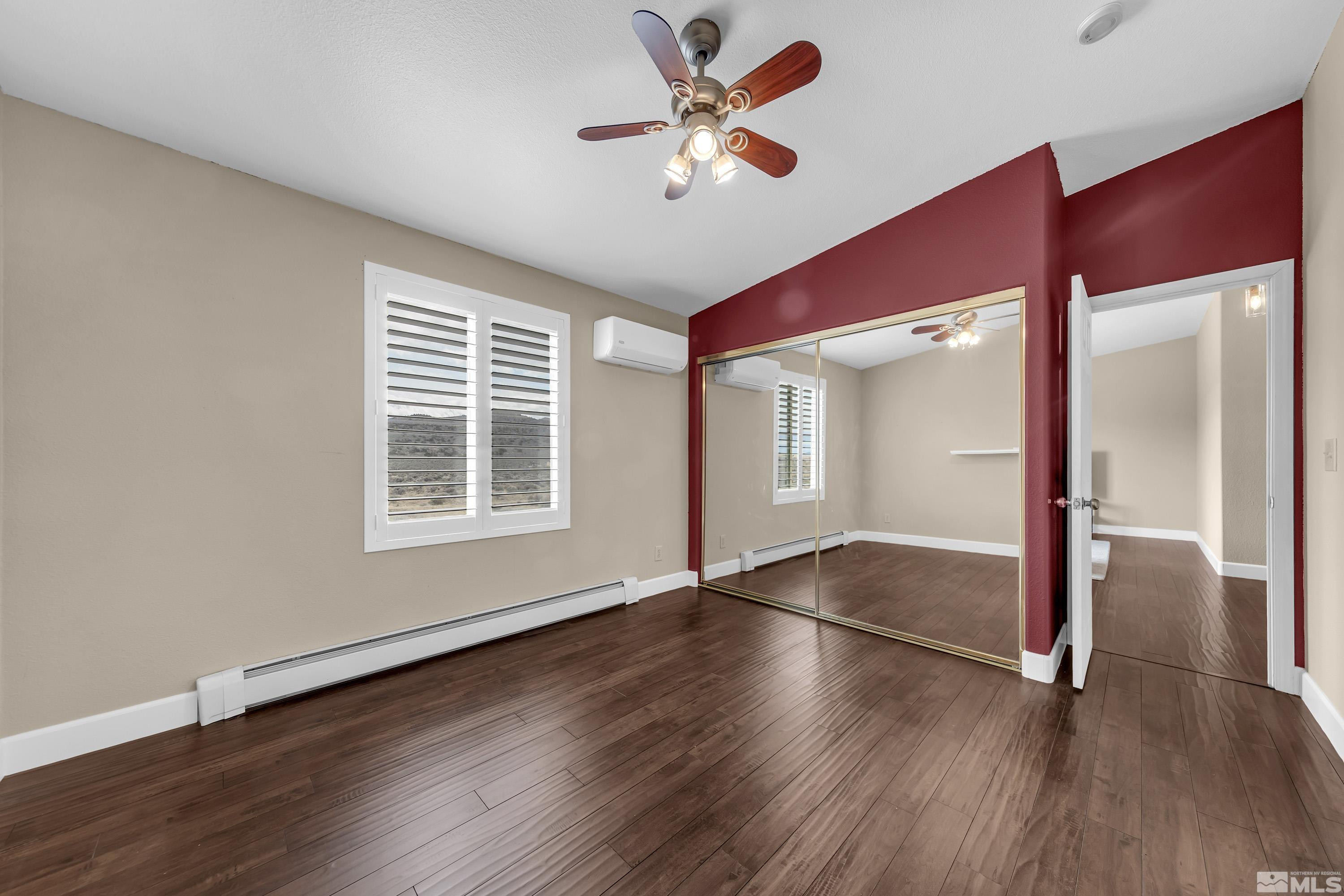 2055 Antelope Valley Road Reno, NV 89506 - Photo 24 of 40 an empty room with wooden floor fan and windows