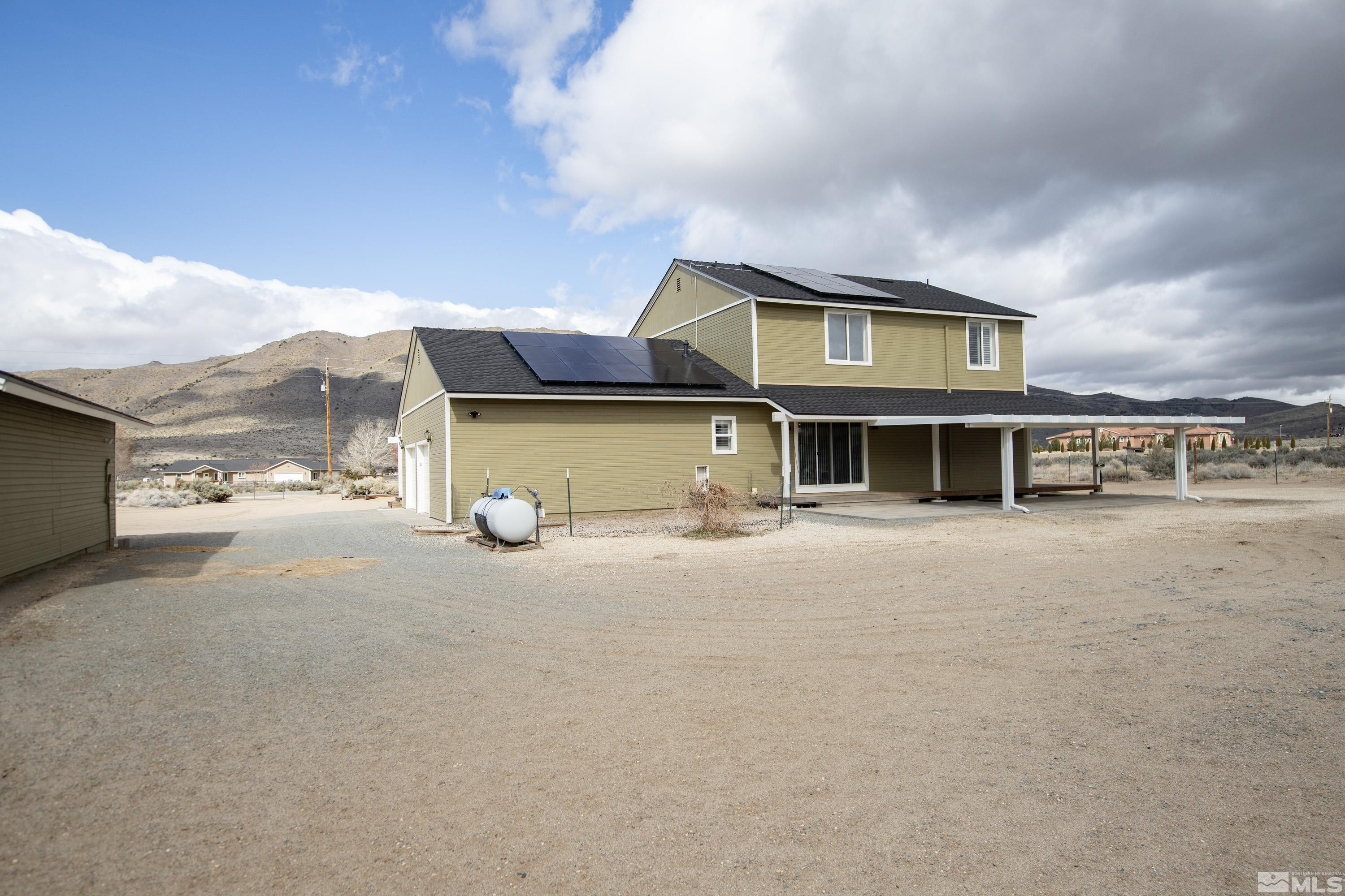 2055 Antelope Valley Road Reno, NV 89506 - Photo 32 of 40 a front view of a house with a yard and balcony