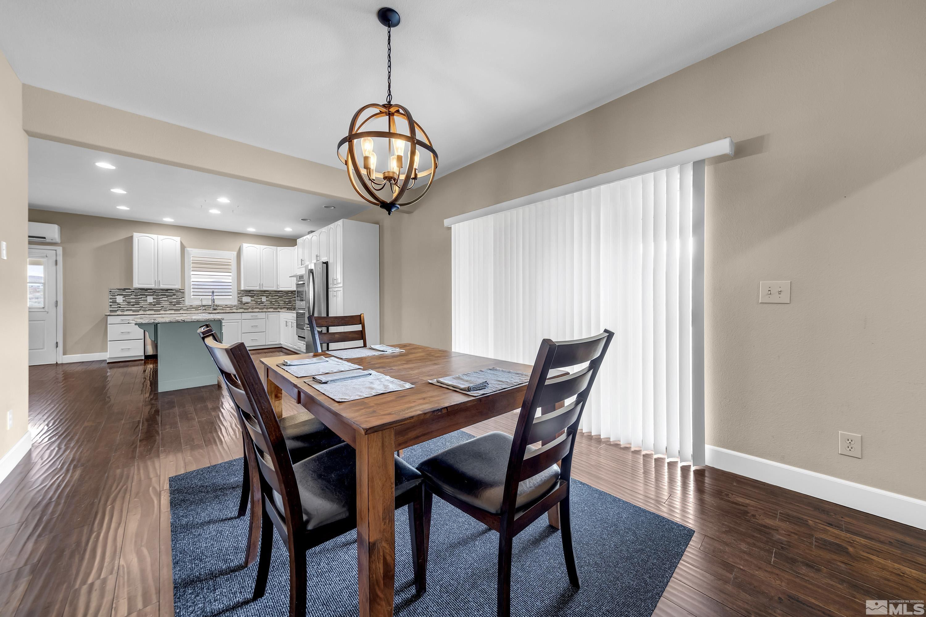 2055 Antelope Valley Road Reno, NV 89506 - Photo 8 of 40 a view of a dining room with furniture wooden floor and chandelier