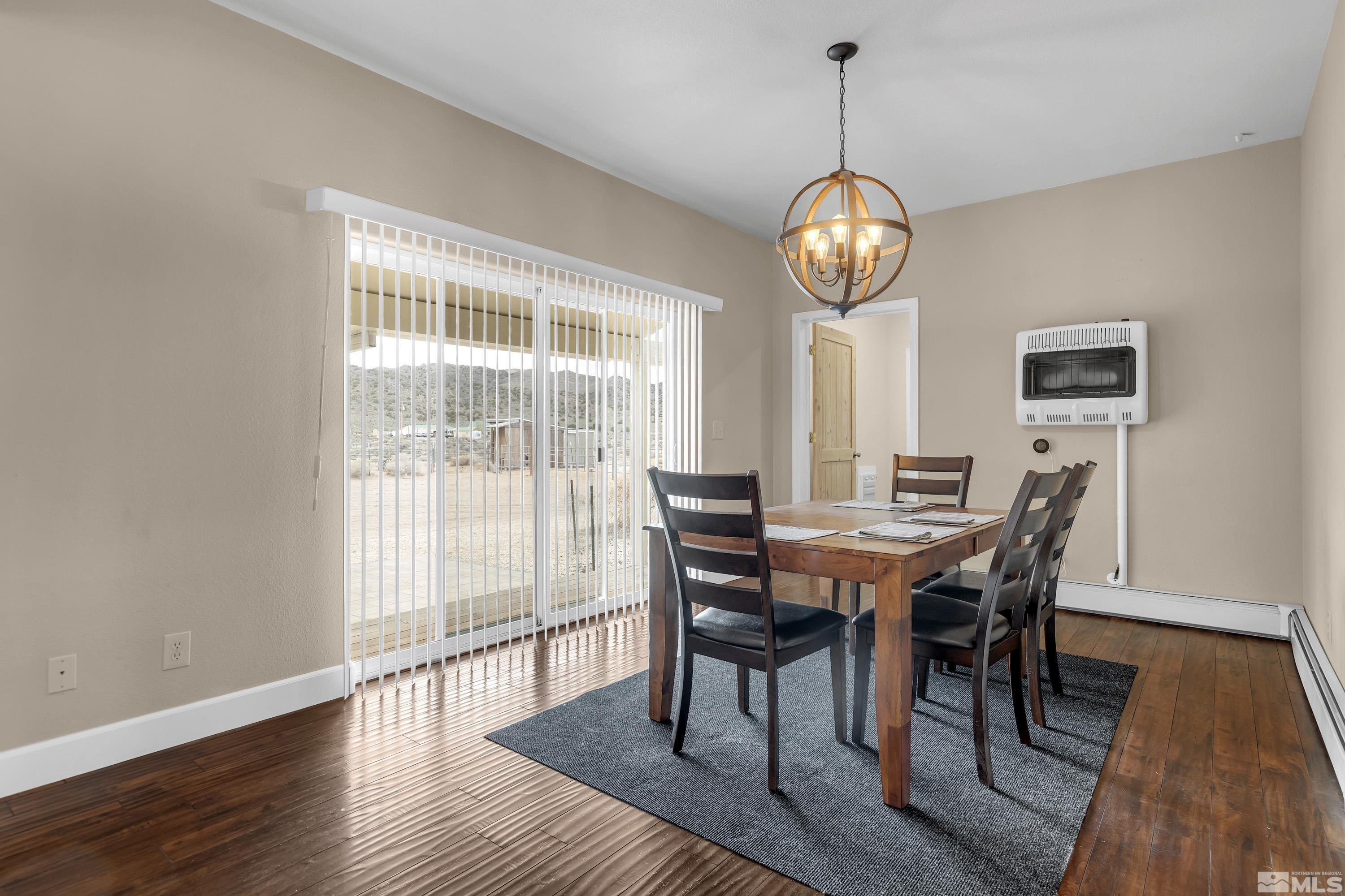 2055 Antelope Valley Road Reno, NV 89506 - Photo 9 of 40 a view of a dining room with furniture window and wooden floor