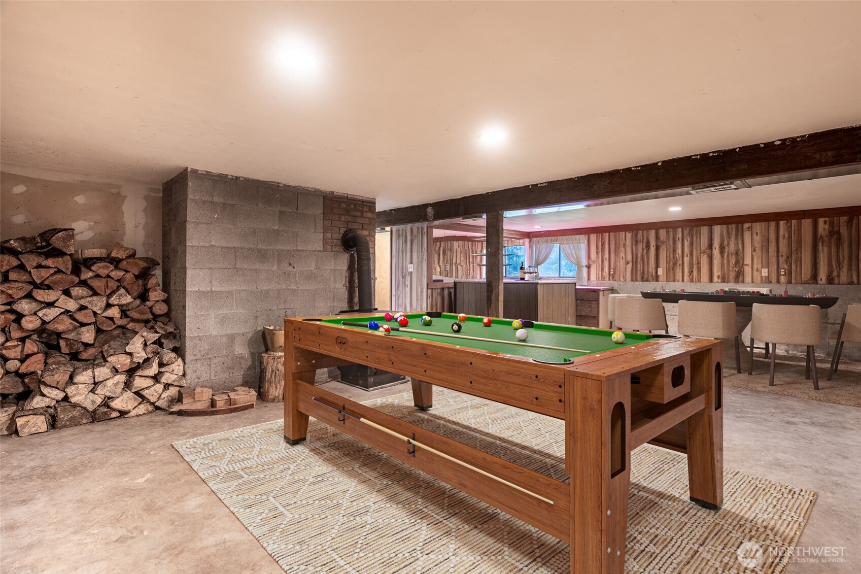 10232 333rd Avenue Southeast Sultan, WA 98294 - Photo 21 of 40 a room with a table and a fireplace