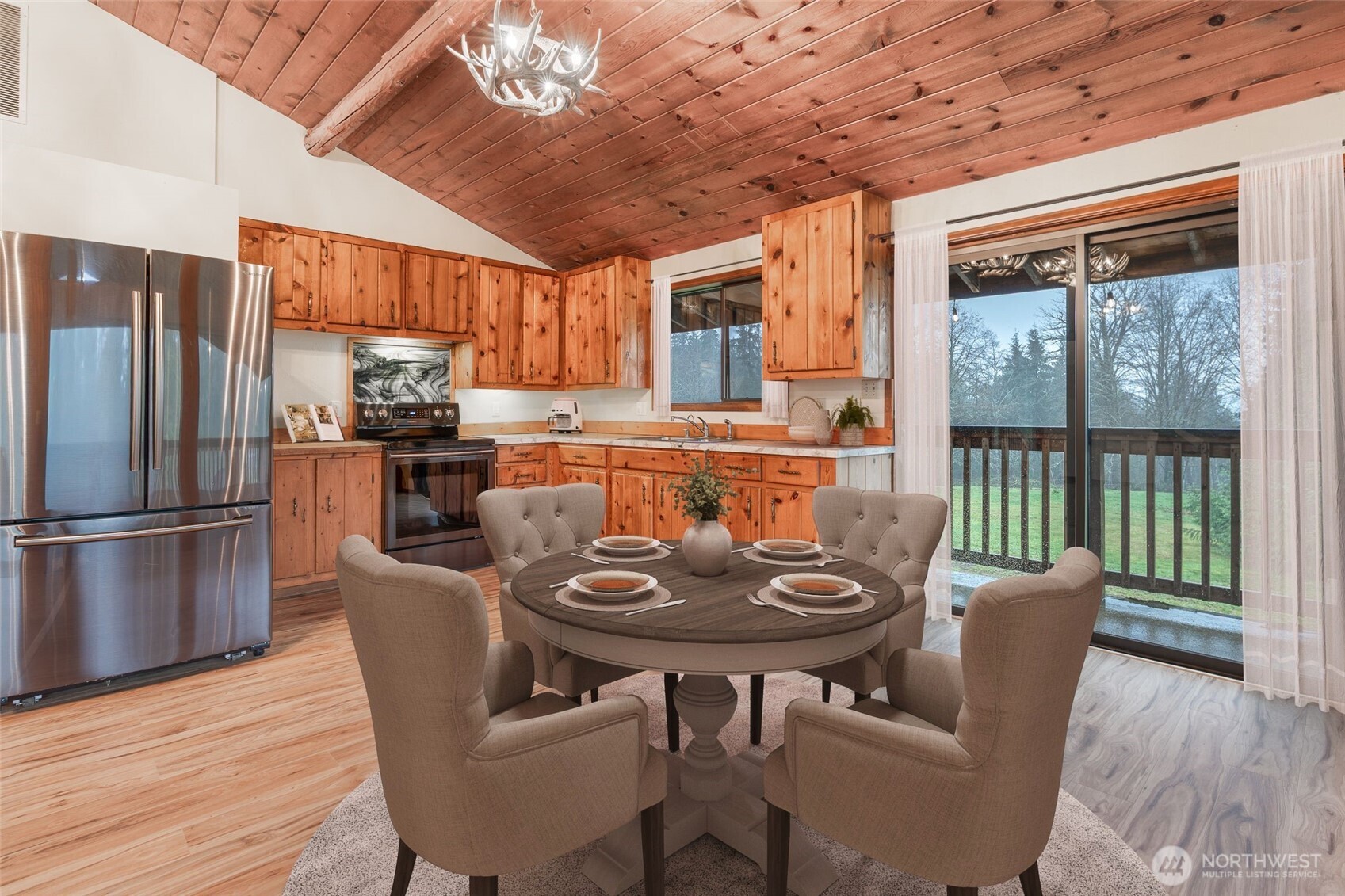10232 333rd Avenue Southeast Sultan, WA 98294 - Photo 10 of 40 a view of a dining room with furniture window and outside view