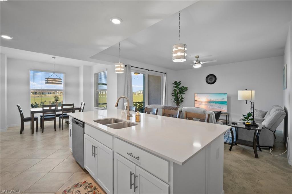 15980 Grassland Lane, Unit 2914 Babcock Ranch, FL 33982 - Photo 16 of 29 a large white kitchen with a large island