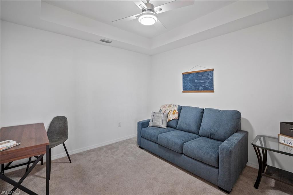 15980 Grassland Lane, Unit 2914 Babcock Ranch, FL 33982 - Photo 17 of 29 a living room with furniture and a window