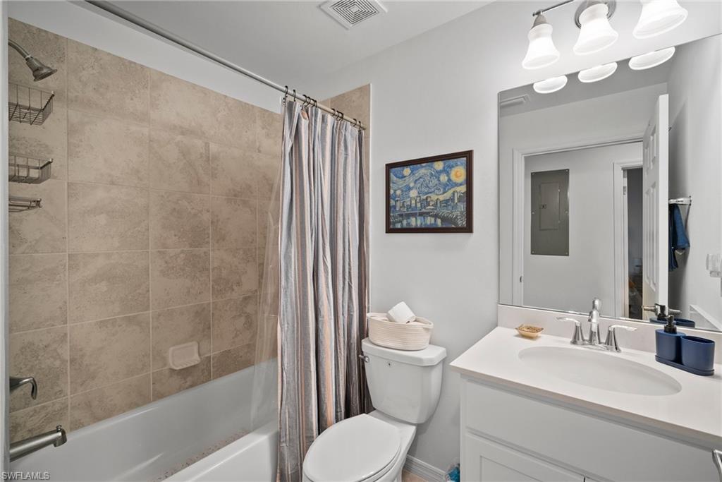 15980 Grassland Lane, Unit 2914 Babcock Ranch, FL 33982 - Photo 18 of 29 a bathroom with a sink toilet a mirror and shower