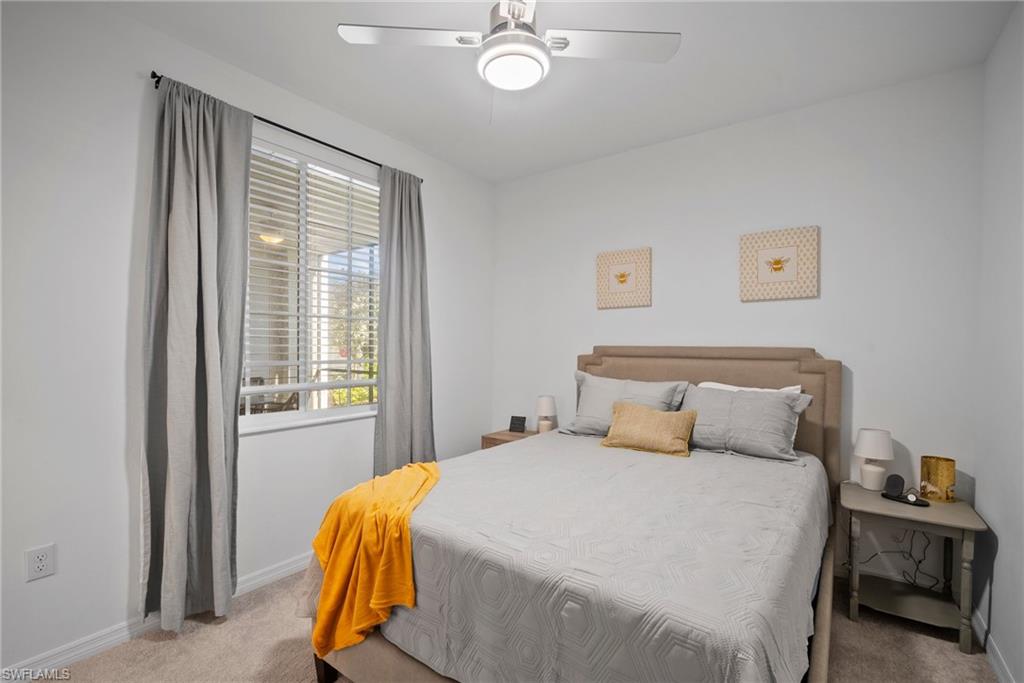 15980 Grassland Lane, Unit 2914 Babcock Ranch, FL 33982 - Photo 20 of 29 a bedroom with a bed and window