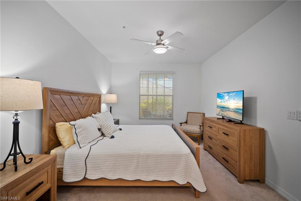 15980 Grassland Lane, Unit 2914 Babcock Ranch, FL 33982 - Photo 22 of 29 a bedroom with a bed and window