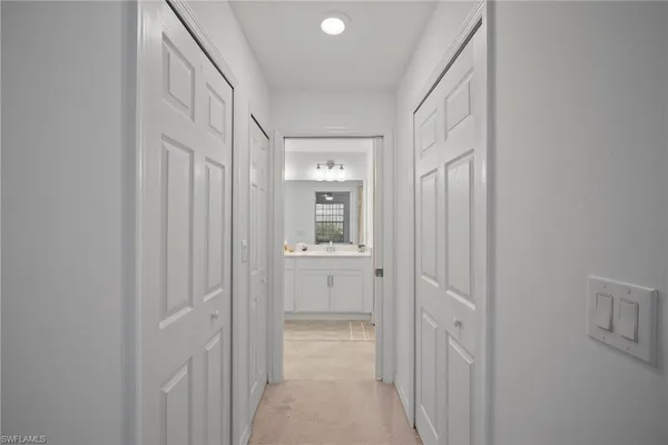 a bathroom with double sink and a mirror