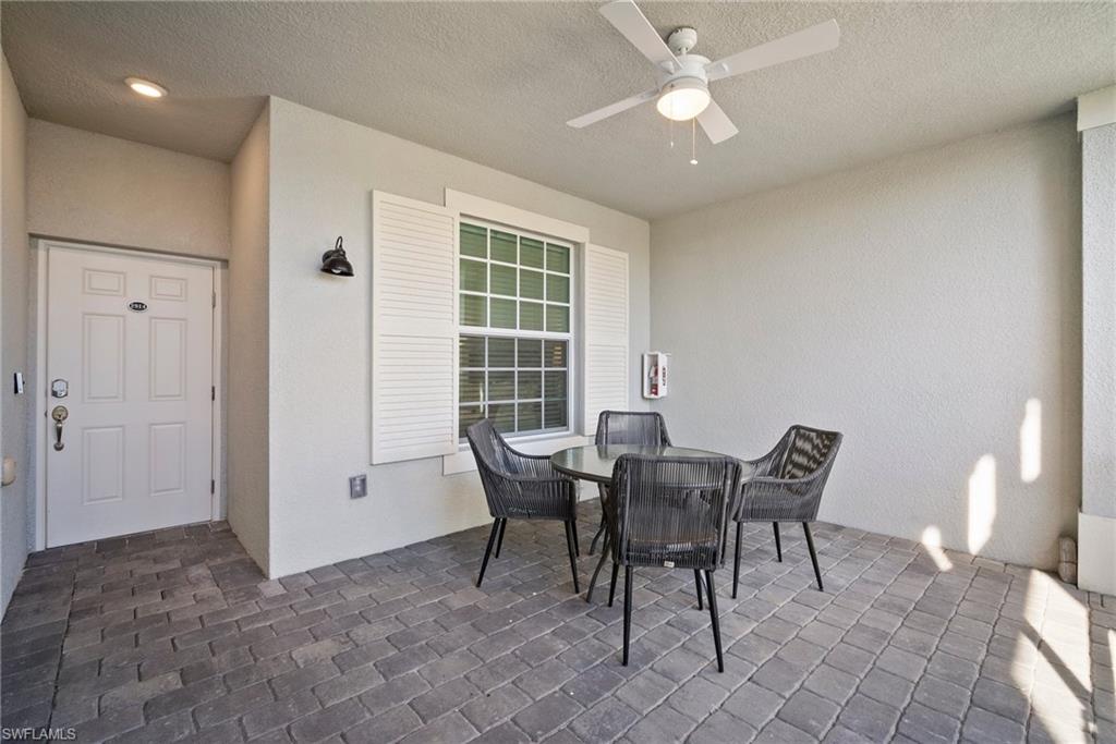 15980 Grassland Lane, Unit 2914 Babcock Ranch, FL 33982 - Photo 7 of 29 a view of a dining room with furniture and chandelier