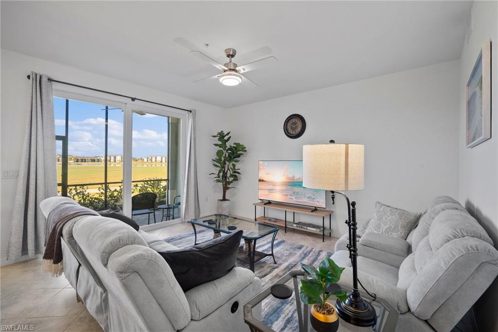 15980 Grassland Lane, Unit 2914 Babcock Ranch, FL 33982 - Photo 9 of 29 a living room with furniture and a large window