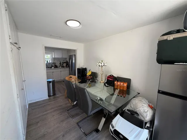 a workspace with furniture and wooden floor