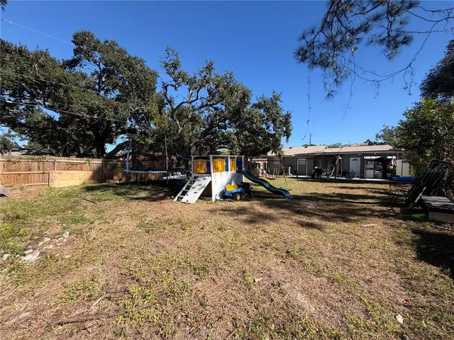 a view of a park with large trees